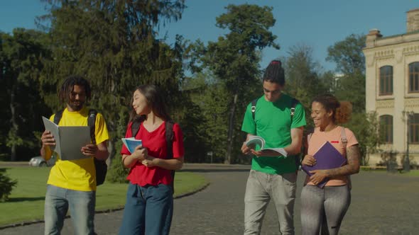 Multiracial Students Walking To Class on Campus