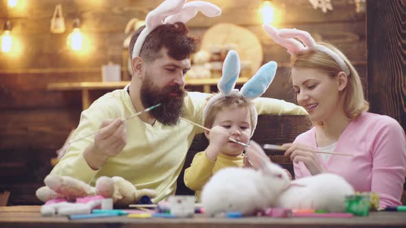 Easter Family Painting Eggs