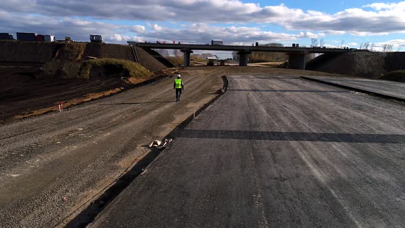 Chief in a White Helmet, Goes and Inspects the Construction of the Road, Aerial Survey