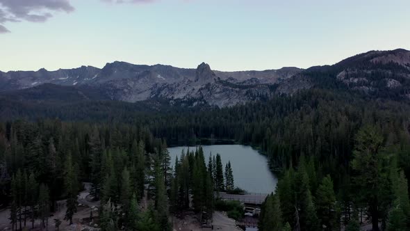 Tranquil Scenery Of Mountains With Dense Conifer Forest At Twin Lakes In California. Aerial Pullback