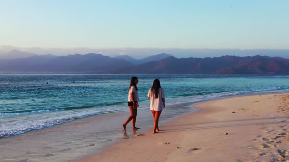 Beautiful ladies happy and smiling on paradise seashore beach journey by blue sea with white sand ba