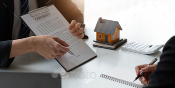 me for rent concept, broker agent presenting and consult detail to customer to making the decision a home estate loan to customer sign form agreement..