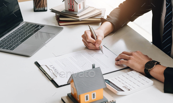 me for rent concept, broker agent presenting and consult detail to customer to making the decision a home estate loan to customer sign form agreement..