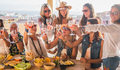 Happy group of beautiful women celebrate a birthday on the terrace with food and drink - PhotoDune Item for Sale