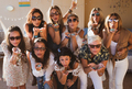 Nine beautiful women enjoying the party blowing on confetti share love and friendship - PhotoDune Item for Sale