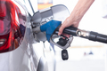 Woman hand filling fuel into the car tank at the pump service station, for concept transportation - PhotoDune Item for Sale