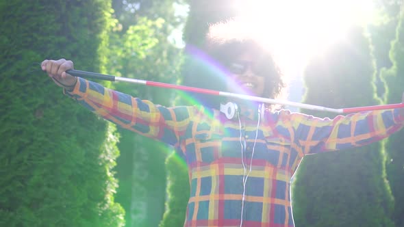 Portrait African American Woman Blind with an Afro Hairstyle with a Canesun Ray Slow Mo