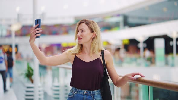 Woman Recording Vlog in Shopping Mall