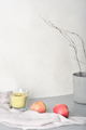 candle and apples on grey table with soft textile and cement pot. ambient blog content. - PhotoDune Item for Sale