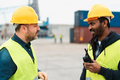 Industrial engineers working in logistic terminal of container cargo - PhotoDune Item for Sale