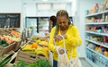 Senior African woman buying fresh fruits in supermarket - PhotoDune Item for Sale