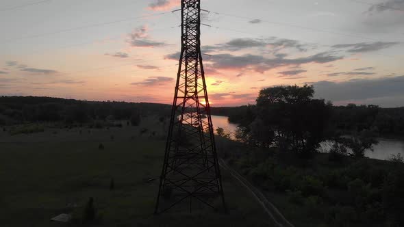 Aerial View Silhouette of Electric Tower Over Sunset Time