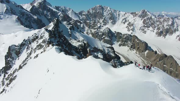 Blue Snow-Capped Mountains in Sunny Day. Aerial View