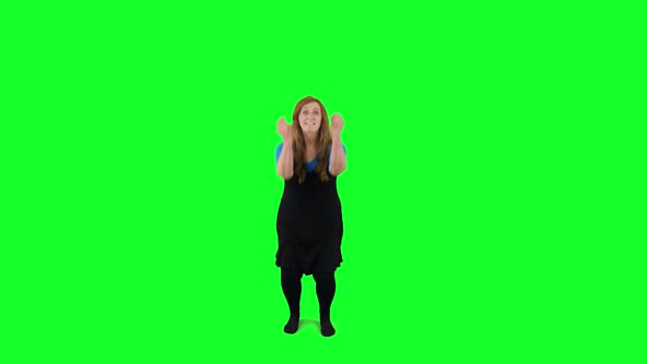 Teacher jumping in front of the green screen