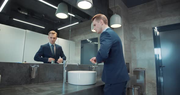 Business Man in Office Bathroom