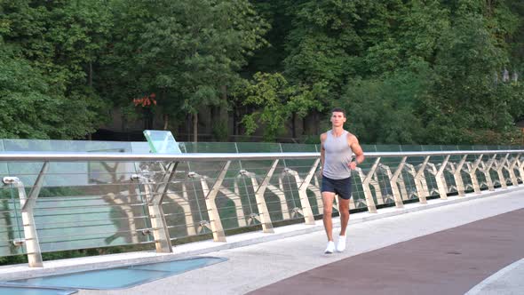 Athletic Muscular Sportsman in Sportswear Running in the Morning Outdoor Competition