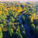 Aerial View of the River Among Forest in the Wild During Fall Season at Sunset - VideoHive Item for Sale