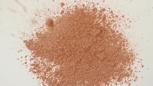 Powder Particles of Cosmetics Fall on the Table