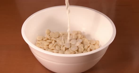 Milk is Poured Into the Dish with White Chocolate