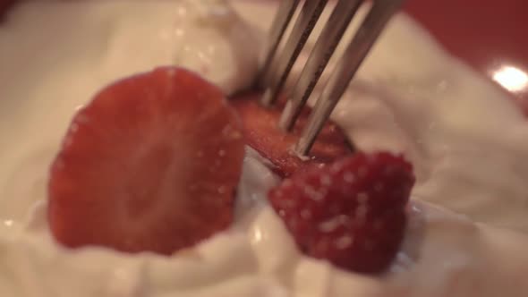 Sliced strawberry in creamy yoghurt