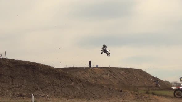 Men racing in a motocross motor sports race.