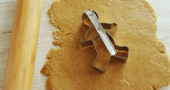 Cookie cutter placed over flattened dough 4k