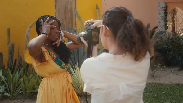 A Beautiful Black Model Poses for a Photographer