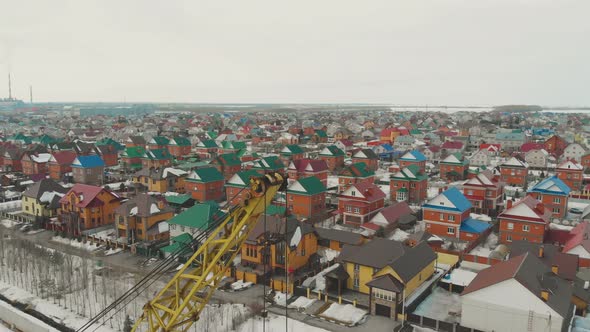 Large Cottage Complex with Green Blue and Red Rooftops