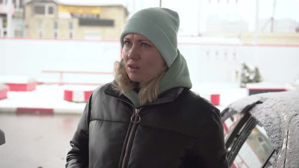A Sad Woman at a Gas Station Was Upset Because of the Rise in Fuel Prices