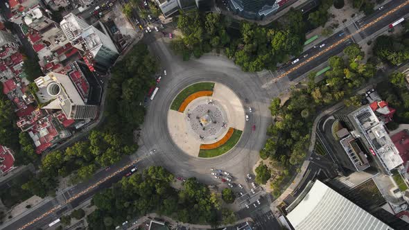 Roundabout Angel of independence on aerial footage in CDMX. Reforma Avenue with cempasuchil on cenit