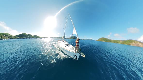 Sailing Vessel with a Woman Remotefilming Herself Onboard