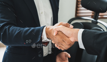 ger and acquisition,successful negotiate, two businessman shake hand with partner to celebration partnership and business deal concept
