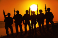 Army soldiers with rifles orange sunset silhouette - PhotoDune Item for Sale