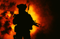 Soldier silhouette on background of fire explosion - PhotoDune Item for Sale