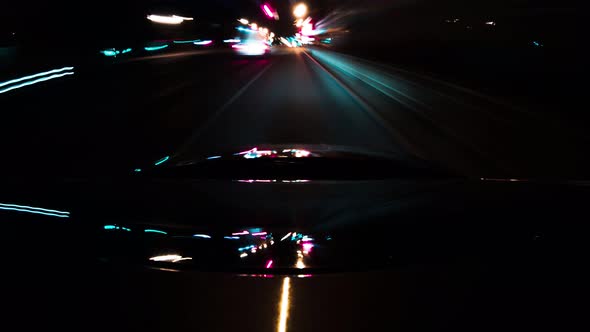 Time Lapse Car Rides Through City at Night in a Tunnel of Neon Lights, Long Exposure