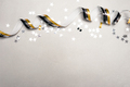 Happy New Year's background with silver star confetti  and golden white streamers. - PhotoDune Item for Sale