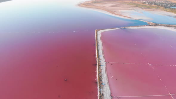 Wonderful Flight Over a Pink Salty Lake at Sunset in the Evening