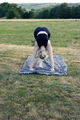 Young woman with blond hair practicing yoga outdoors. - PhotoDune Item for Sale