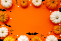 Halloween flat lay composition of black  bats and pumpkins on orange background. Halloween concept. - PhotoDune Item for Sale