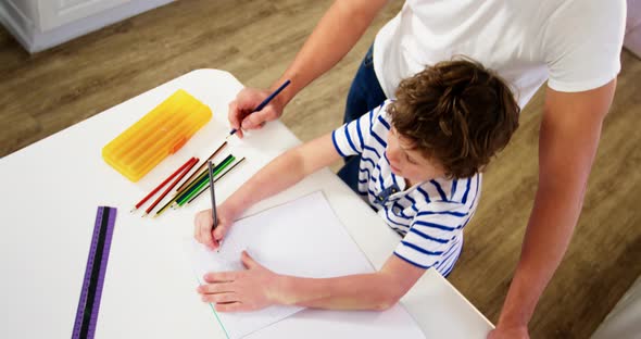 Father helping son with homework