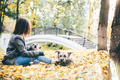 Women hugging dog in the autumn park. - PhotoDune Item for Sale