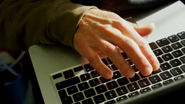 Craftsman using laptop in workshop 4k