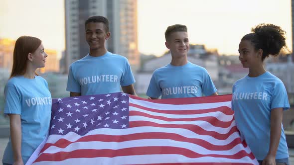 Happy Multi-Racial Volunteers Holding American Flag, Charity Foundation, Help