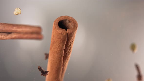 Clash of Flying Spices and Cinnamon Stick Cracking in Slow Motion