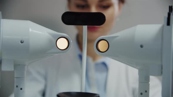 The Ophthalmologist Examines the Patient's Eye Using Special Equipment