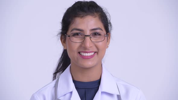 Face of Young Happy Persian Woman Doctor Smiling