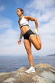 Athletic Woman Stretching Leg During Outdoor Workout - PhotoDune Item for Sale