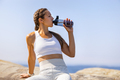 Female Athlete Drinking Water During Outdoor Workout by the Sea - PhotoDune Item for Sale