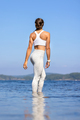 Athletic Woman Standing In Sea Against Clear Sky - PhotoDune Item for Sale
