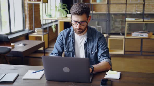 Smart Caucasian Business Man Typing on Laptop Computer Working Studying Online